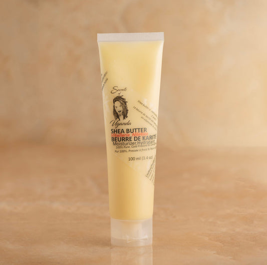 100ml Tube of Nilotica Shea Butter on a Brown Background