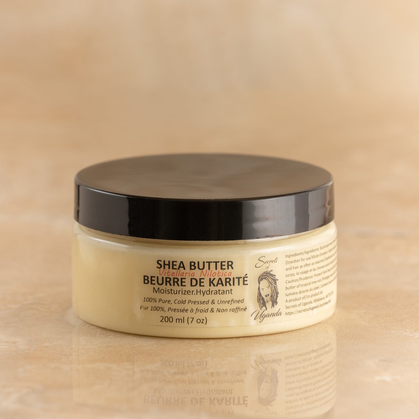 200ml Jar of Nilotica Shea Butter on a Brown Background